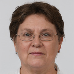 Joyful white middle-aged female with short  brown hair and brown eyes