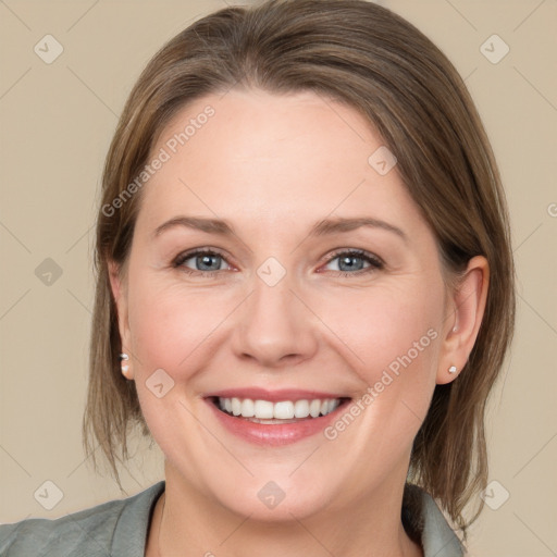 Joyful white young-adult female with medium  brown hair and grey eyes