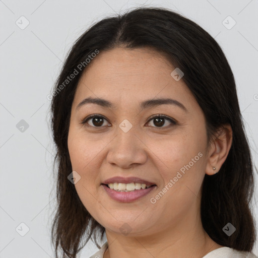 Joyful white adult female with medium  brown hair and brown eyes