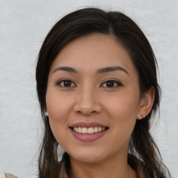 Joyful asian young-adult female with long  brown hair and brown eyes