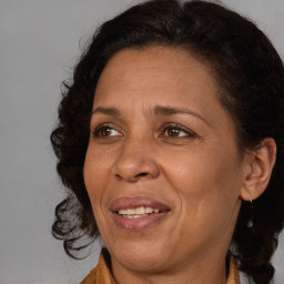 Joyful black adult female with medium  brown hair and brown eyes