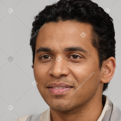 Joyful latino young-adult male with short  black hair and brown eyes