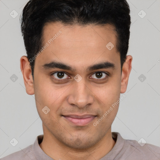 Joyful latino young-adult male with short  brown hair and brown eyes