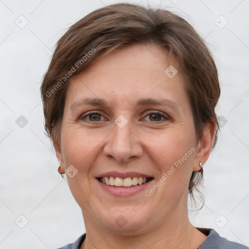 Joyful white adult female with short  brown hair and grey eyes