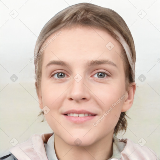 Joyful white young-adult female with short  brown hair and grey eyes