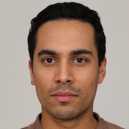 Neutral latino young-adult male with short  black hair and brown eyes
