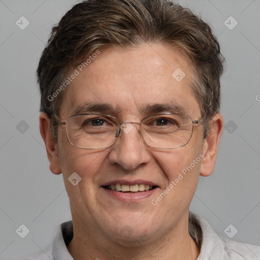 Joyful white adult male with short  brown hair and grey eyes