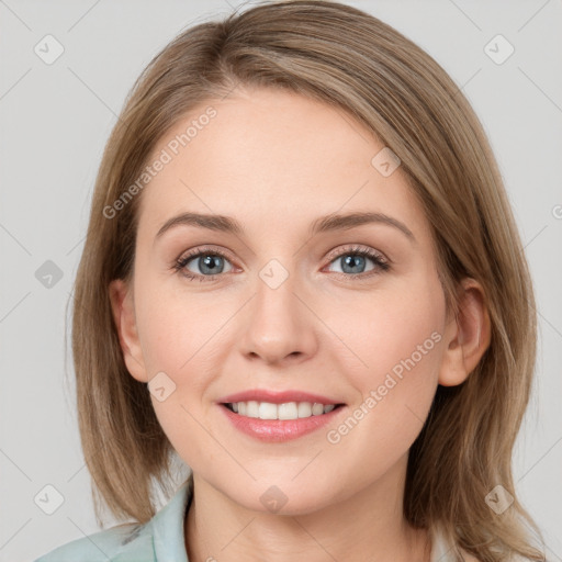 Joyful white young-adult female with medium  brown hair and blue eyes