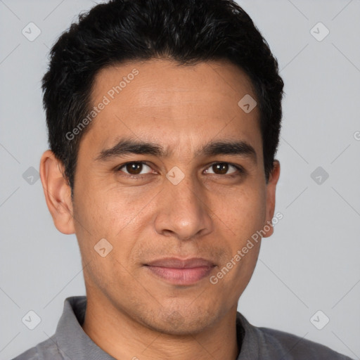 Joyful white young-adult male with short  black hair and brown eyes