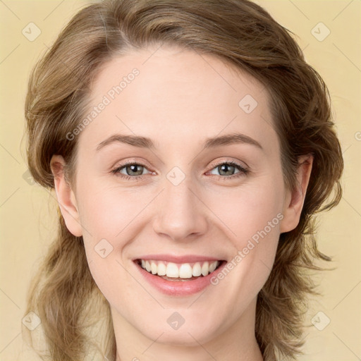 Joyful white young-adult female with medium  brown hair and green eyes