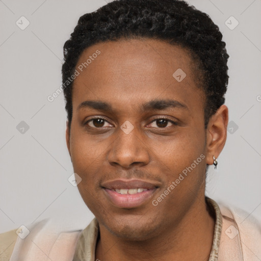 Joyful black young-adult male with short  black hair and brown eyes