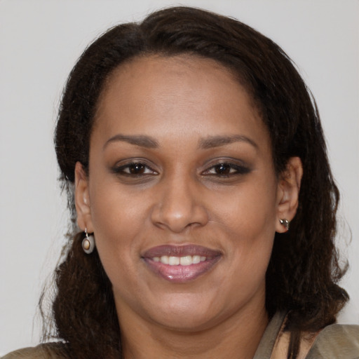 Joyful white adult female with medium  brown hair and brown eyes