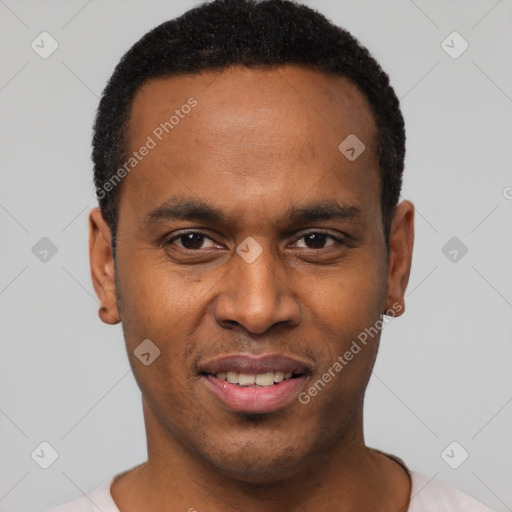 Joyful black young-adult male with short  black hair and brown eyes