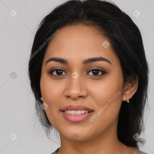 Joyful latino young-adult female with long  black hair and brown eyes