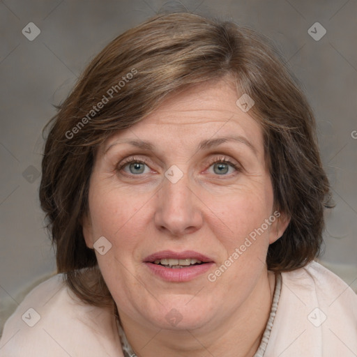 Joyful white adult female with medium  brown hair and blue eyes