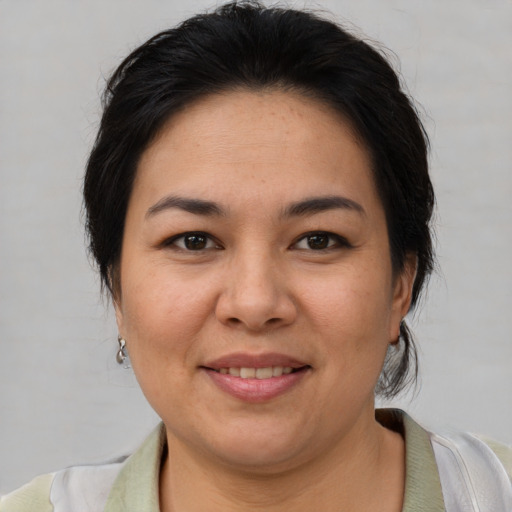 Joyful white adult female with short  brown hair and brown eyes