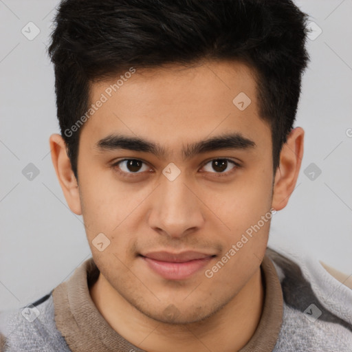 Joyful latino young-adult male with short  brown hair and brown eyes