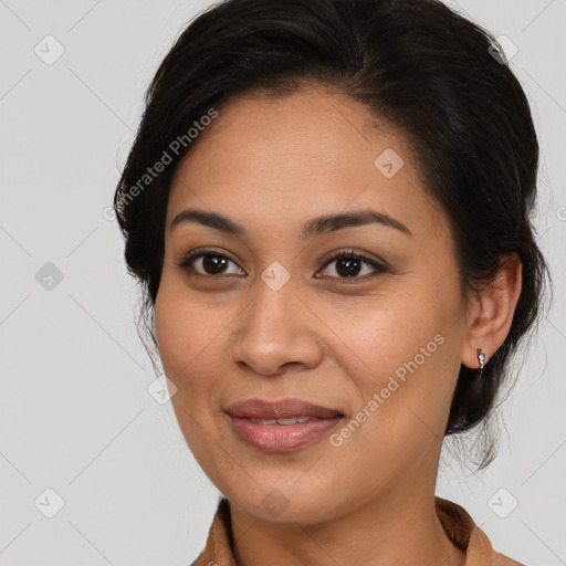 Joyful latino young-adult female with medium  brown hair and brown eyes