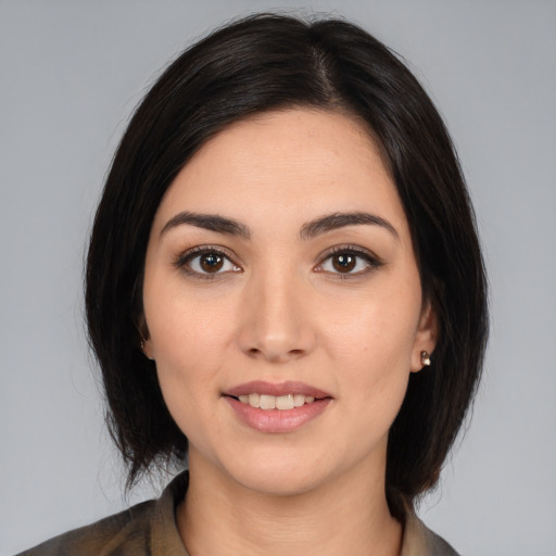 Joyful white young-adult female with medium  black hair and brown eyes