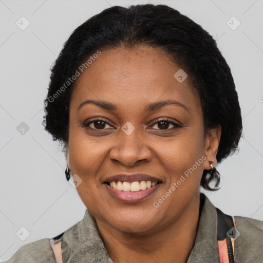 Joyful black adult female with short  brown hair and brown eyes