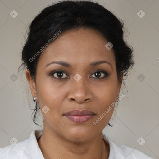 Joyful black adult female with medium  brown hair and brown eyes