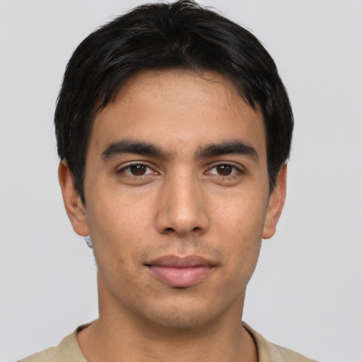 Joyful asian young-adult male with short  black hair and brown eyes