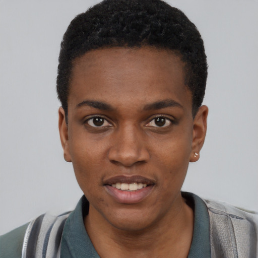 Joyful black young-adult male with short  black hair and brown eyes