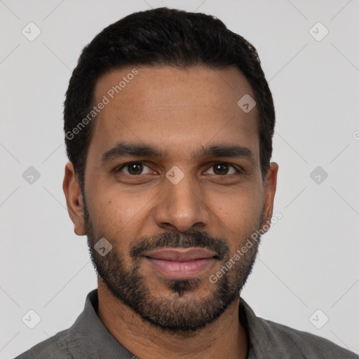 Joyful black young-adult male with short  black hair and brown eyes