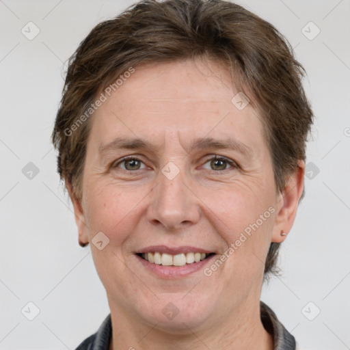 Joyful white adult female with short  brown hair and grey eyes