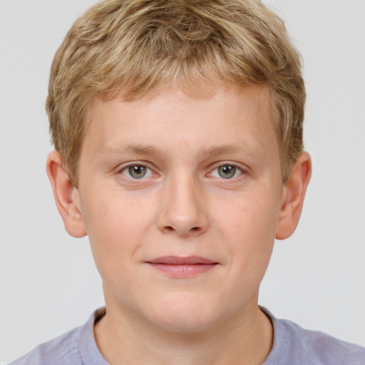 Joyful white child male with short  brown hair and grey eyes