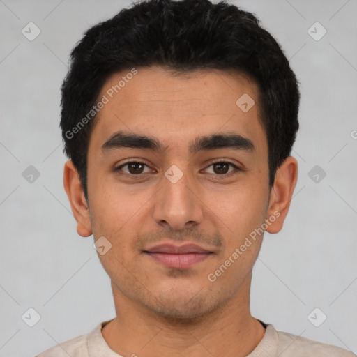 Joyful latino young-adult male with short  black hair and brown eyes