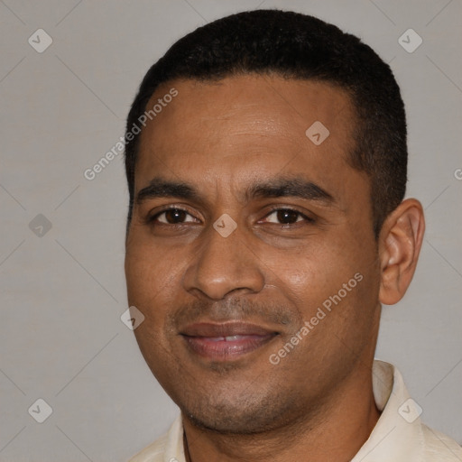 Joyful black young-adult male with short  black hair and brown eyes