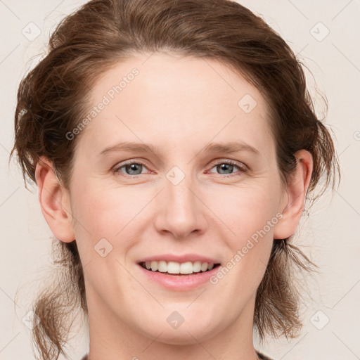 Joyful white young-adult female with medium  brown hair and grey eyes