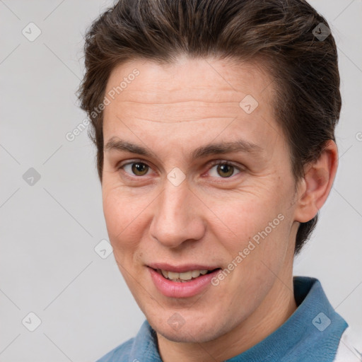 Joyful white adult male with short  brown hair and brown eyes