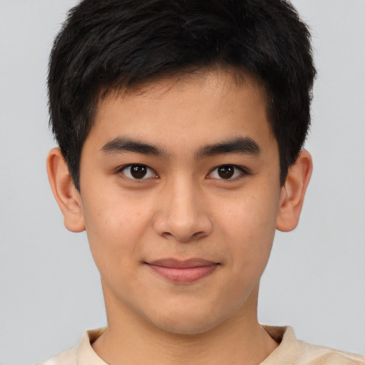 Joyful latino young-adult male with short  brown hair and brown eyes
