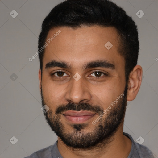 Joyful latino young-adult male with short  black hair and brown eyes