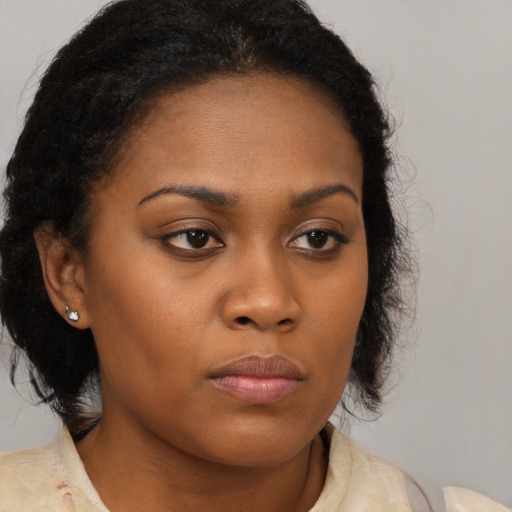 Neutral black young-adult female with long  brown hair and brown eyes