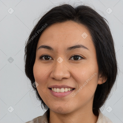 Joyful asian young-adult female with medium  brown hair and brown eyes