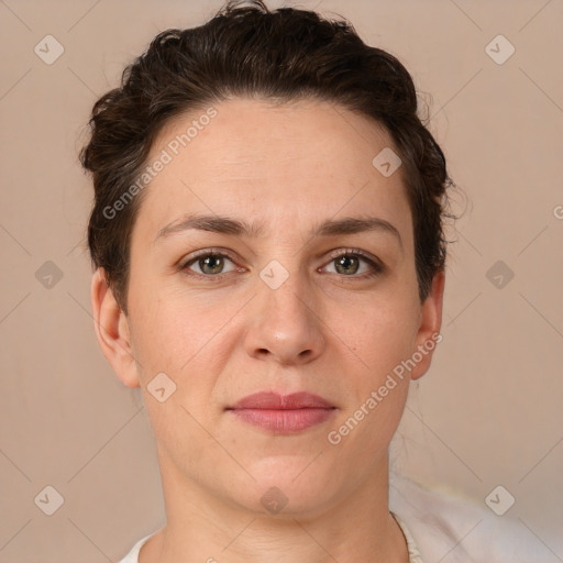 Joyful white adult female with short  brown hair and brown eyes