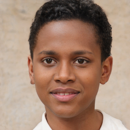 Joyful black young-adult male with short  brown hair and brown eyes