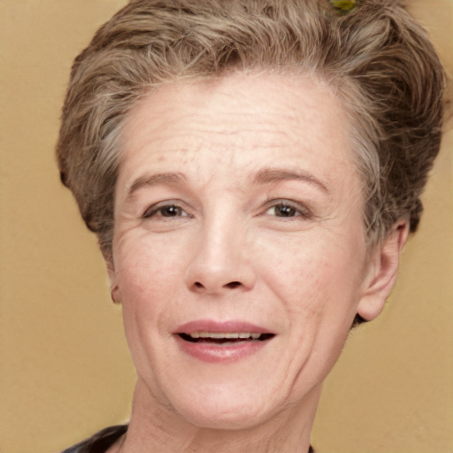 Joyful white middle-aged female with medium  brown hair and grey eyes