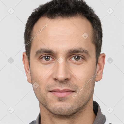 Joyful white adult male with short  brown hair and brown eyes