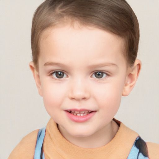 Joyful white child female with short  brown hair and brown eyes