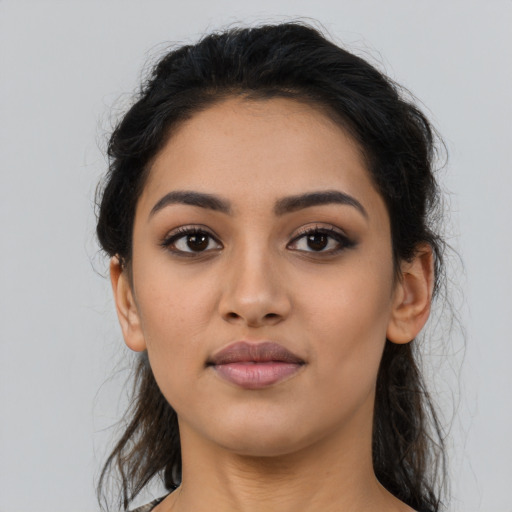 Neutral latino young-adult female with long  brown hair and brown eyes