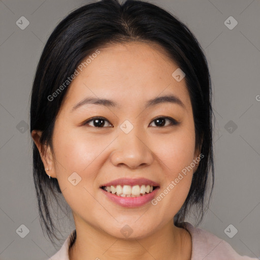 Joyful asian young-adult female with medium  black hair and brown eyes