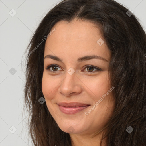 Joyful white adult female with long  brown hair and brown eyes