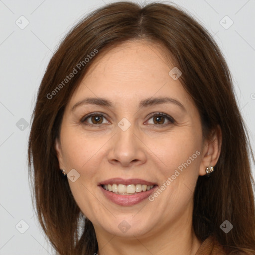 Joyful white adult female with long  brown hair and brown eyes