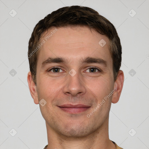 Joyful white young-adult male with short  brown hair and grey eyes