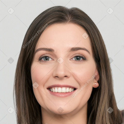 Joyful white young-adult female with long  brown hair and green eyes