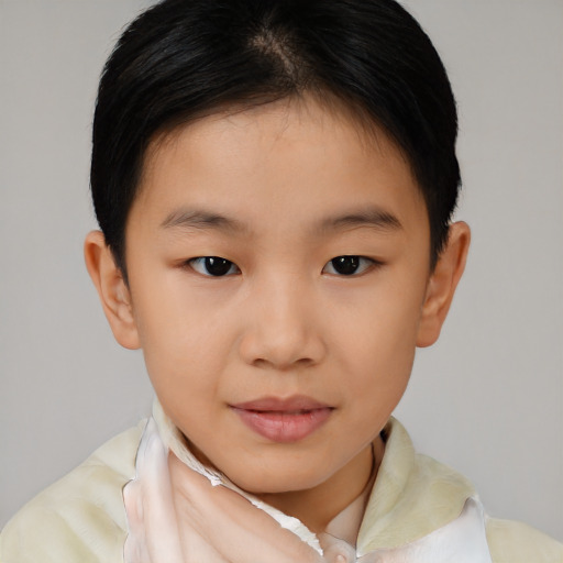 Joyful asian child female with short  brown hair and brown eyes